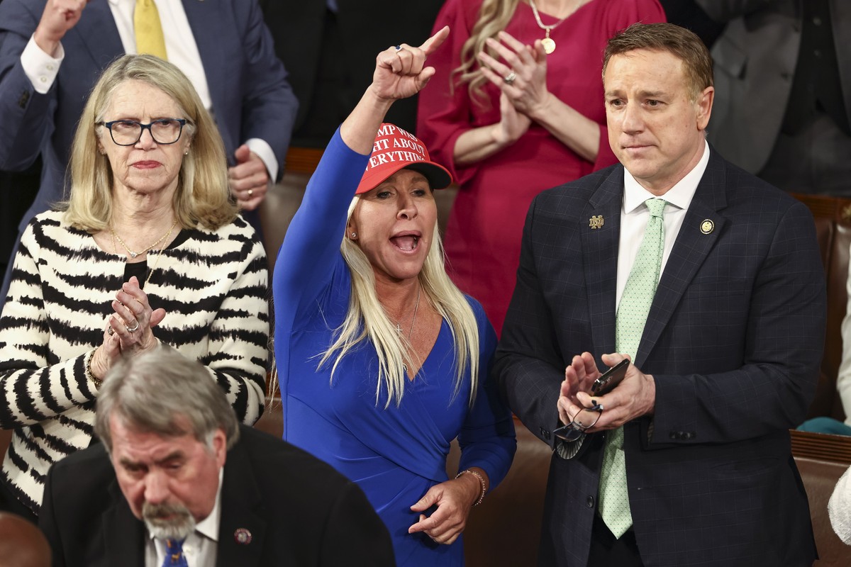 epa11941200 Republican Congressman Marjorie Taylor Greene of Georgia heckles Democrats during President Donald Trump's address to a joint session of the United States Congress in the House Chambe ...