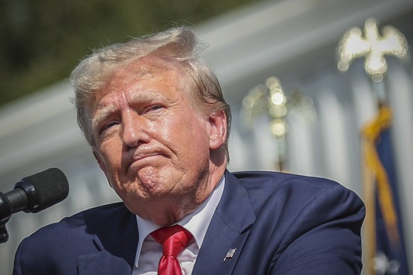 FILE - Former President Donald Trump pauses before ending his remarks at a rally in Summerville, S.C., Sept. 25, 2023. A New York judge ruled, Tuesday, Sept. 26, 2023, that the former president and hi ...