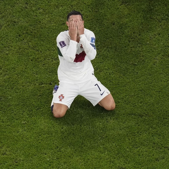 Portugal's Cristiano Ronaldo, reacts after he failed to score during the World Cup quarterfinal soccer match between Morocco and Portugal, at Al Thumama Stadium in Doha, Qatar, Saturday, Dec. 10, ...