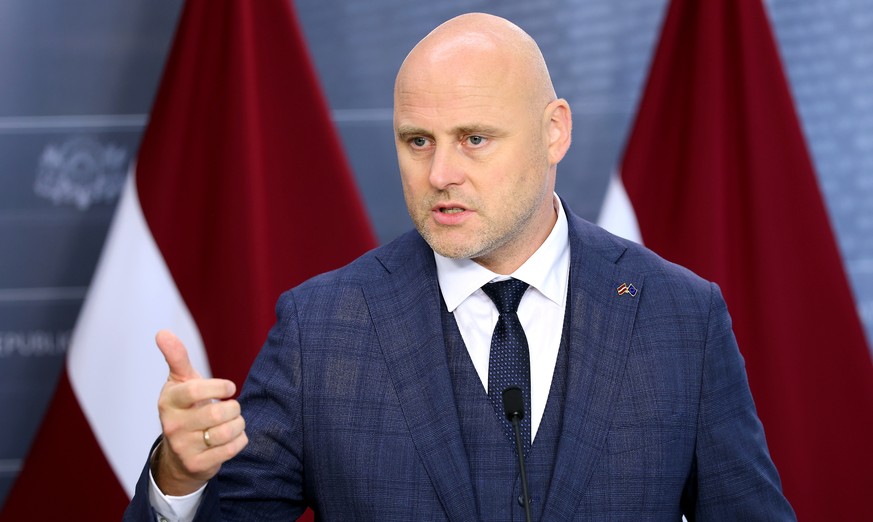 epa13193164 Latvian Prime Minister Andris Kulbergs attends a joint press conference with the President of the European Council, Antonio Costa (not pictured), after their meeting in Riga, Latvia, 26 Au ...