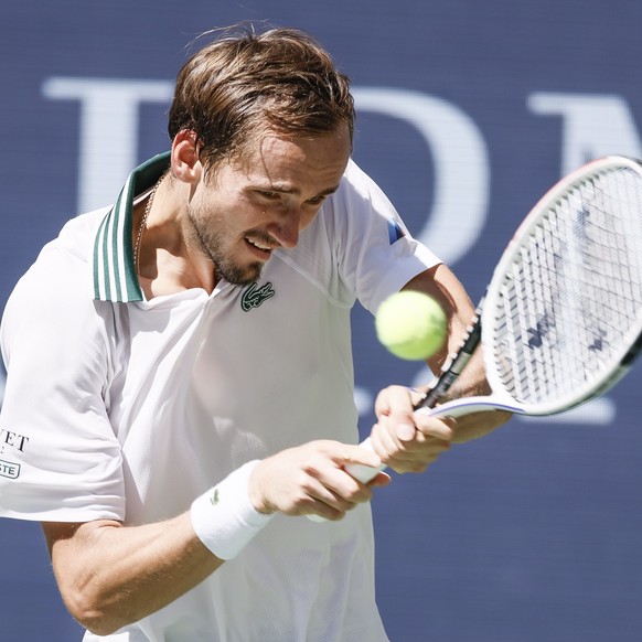 epa09454100 Daniil Medvedev of Russia hits a return to Botic van de Zandschulp of the Netherlands during their quarterfinal match on the ninth day of the US Open Tennis Championships the USTA National ...