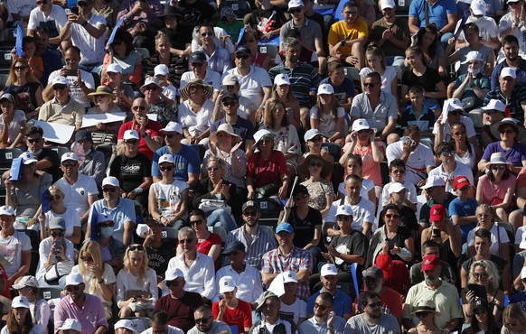 Fans watch a tennis match between Serbia&#039;s Novak Djokovic and Germany&#039;s Alexander Zverev, of the Adria Tour charity tournament in Belgrade, Serbia, Sunday, June 14, 2020. (AP Photo/Darko Voj ...