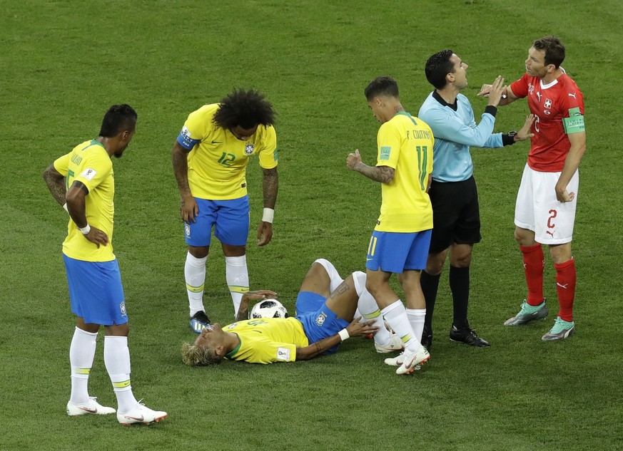 Brazil's Neymar reacts as he lies on the ground during the group E match between Brazil and Switzerland at the 2018 soccer World Cup in the Rostov Arena in Rostov-on-Don, Russia, Sunday, June 17, ...