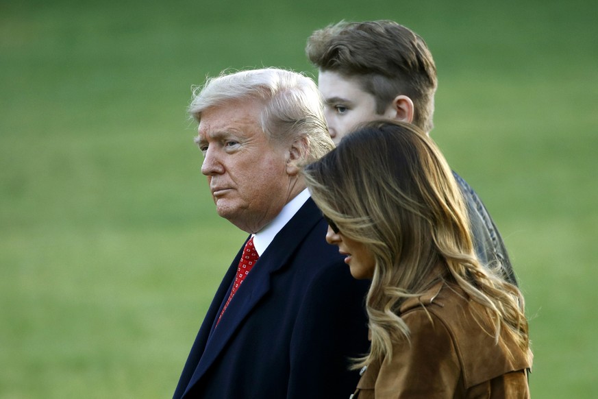 President Donald Trump walks with first lady Melania Trump and son Barron Trump on the South Lawn of the White House in Washington, Tuesday, Nov. 26, 2019, before boarding Marine One for a short trip  ...