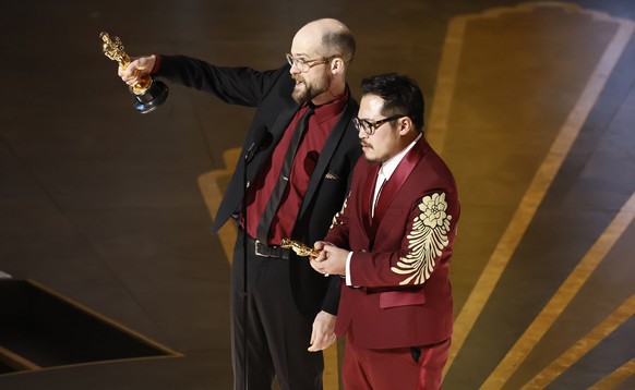 epa10519029 Daniel Scheinert and Daniel Kwan (R) after winning the Oscar for Best Direction for 