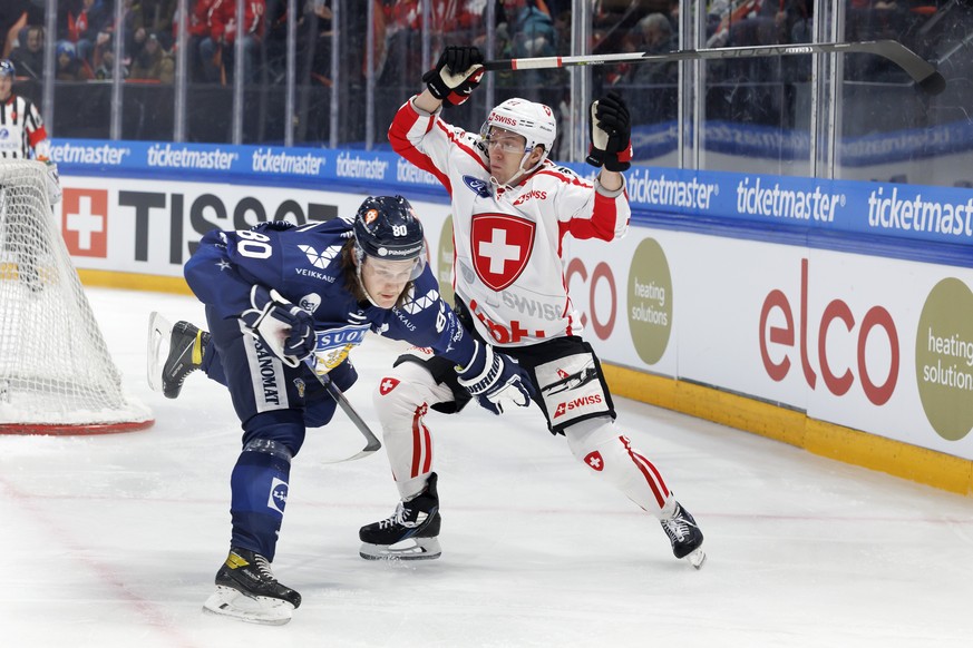 Finland&#039;s defender Sami Niku, left, vies for the puck with Switzerland&#039;s forward Killian Mottet, right, during the Euro Hockey Tour - Swiss Ice Hockey Games 2022 between Switzerland and Finl ...