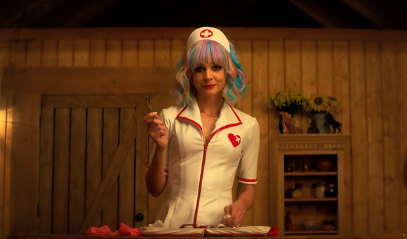 This image released by Focus Features shows Carey Mulligan in a scene from the film "Promising Young Woman." Mulligan was nominated for a Golden Globe for best actress in a motion picture dr ...