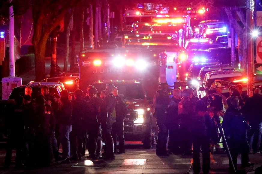 Emergency personnel gather on Waterman Street at Brown University in Providence, R.I., on Saturday, Dec. 13, 2025, during the investigation of a shooting. (AP Photo/Mark Stockwell)
Brown University Sh ...