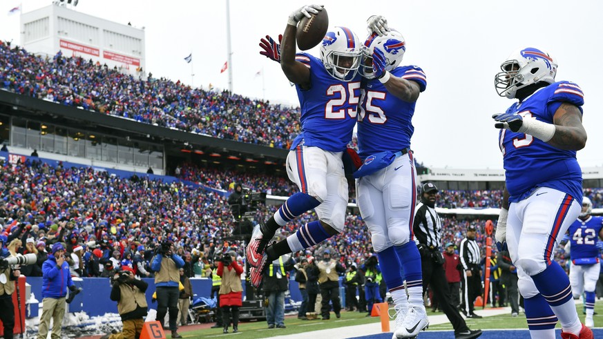 Buffalo Bills running back LeSean McCoy (25) celebrates with teammates Charles Clay (85) and Dion Dawkins (73) after catching a pass for a touchdown during the first half of an NFL football game again ...