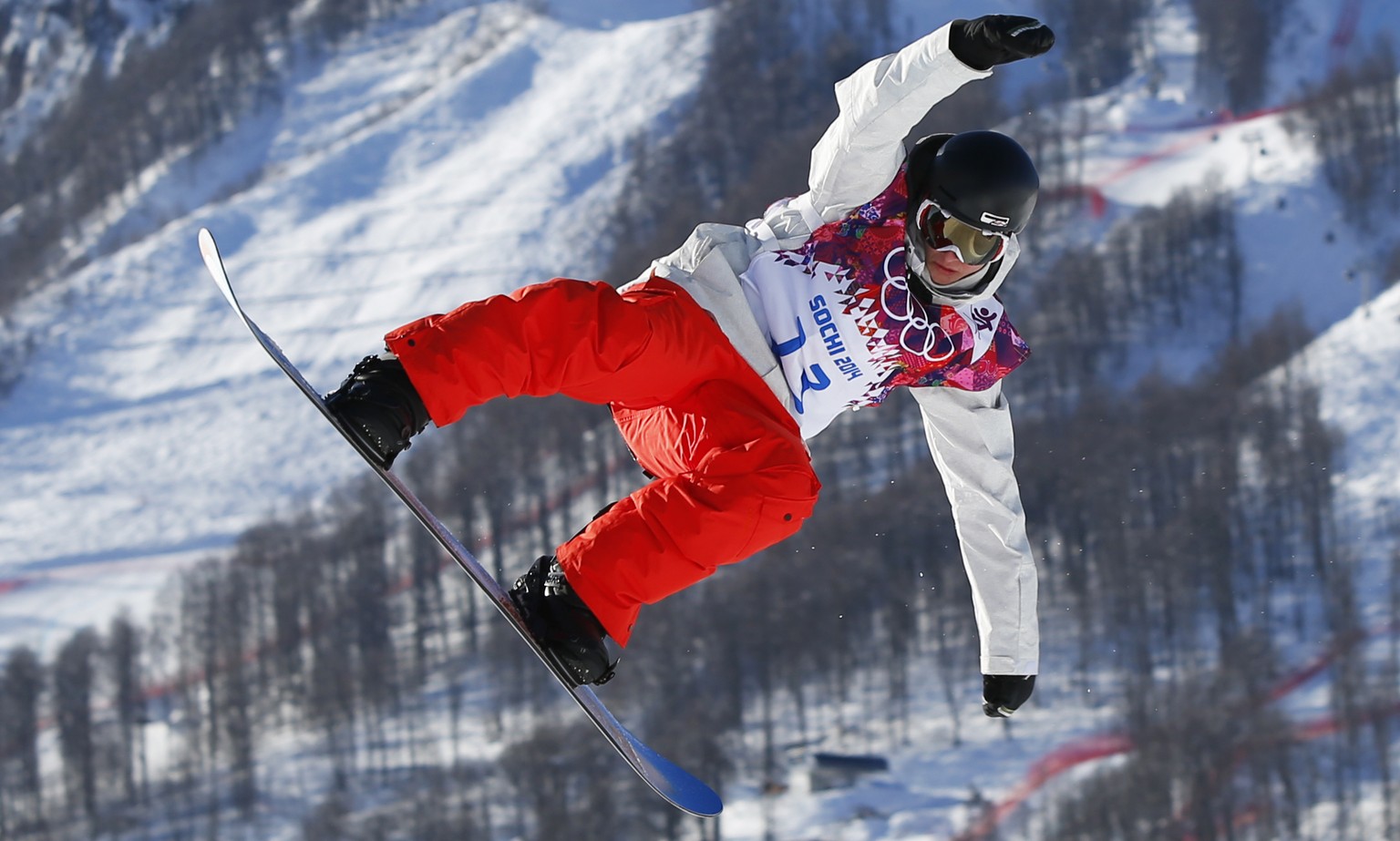 Switzerland&#039;s Lucien Koch takes a jump during men&#039;s snowboard slopestyle qualifying at the Rosa Khutor Extreme Park ahead of the 2014 Winter Olympics, Thursday, Feb. 6, 2014, in Krasnaya Pol ...