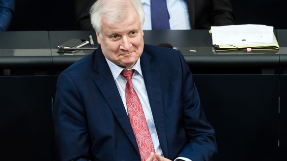 epa06810380 German Minister of Interior, Construction and Homeland Horst Seehofer sits on the government bench prior to a topical debate (Aktuelle Stunde) on the Master Plan refugee and integration po ...