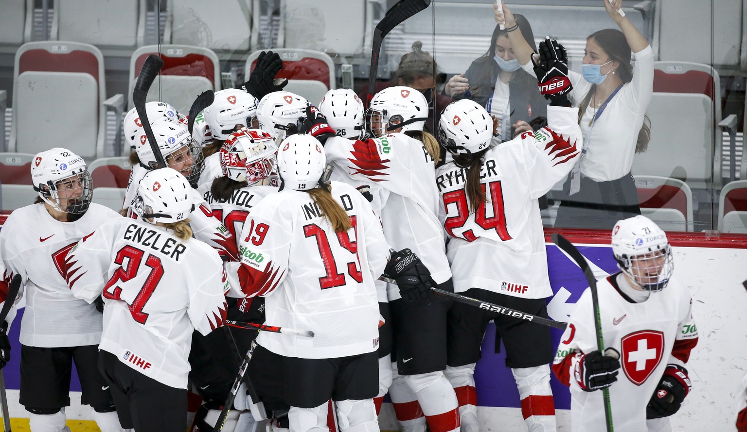 Switzerland celebrate after defeating Russian Olympic Committee during overtime quarterfinal IIHF Women&#039;s World Championship hockey game in Calgary, Alta., Saturday, Aug. 28, 2021. (Jeff McIntosh ...