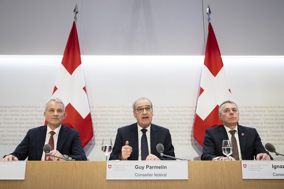 Swiss Federal councillor Guy Parmelin, center, speaks next to Swiss Federal councillor Beat Jans, left, and Swiss Federal councillor Ignazio Cassis, right, during a press conference on the conclusion  ...