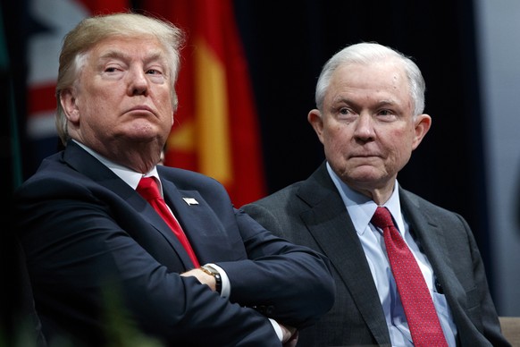 FILE - In this Dec. 15, 2017 file photo, President Donald Trump, left, appears with Attorney General Jeff Sessions during the FBI National Academy graduation ceremony in Quantico, Va. Trump, an ardent ...