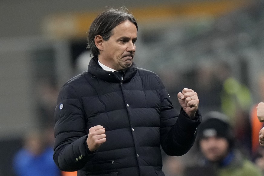 Inter Milan&#039;s head coach Simone Inzaghi, left. celebrates after the end of the Serie A soccer match between Inter Milan and Genoa at the San Siro stadium in Milan, Italy, Monday, March 4, 2024. ( ...