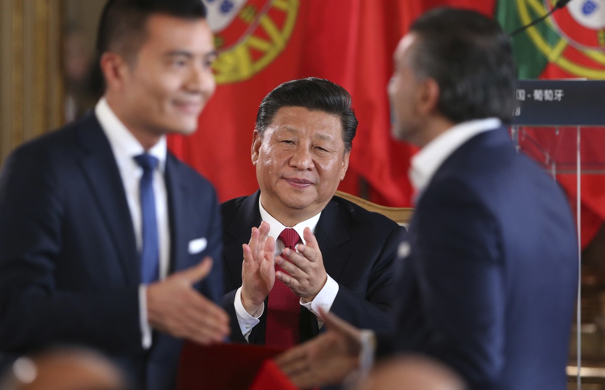 China's President Xi Jinping applauds during the signing of agreements between the Portugal and China, Wednesday, Dec. 5, 2018, at the Queluz National Palace in Queluz, outside Lisbon. Portugal i ...