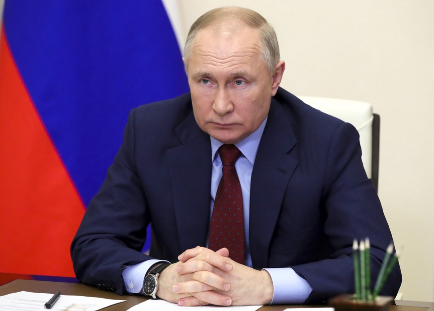 Russian President Vladimir Putin attends a meeting on the development of agricultural and fishing industries via videoconference at the Novo-Ogaryovo state residence outside Moscow, Russia, Tuesday, A ...
