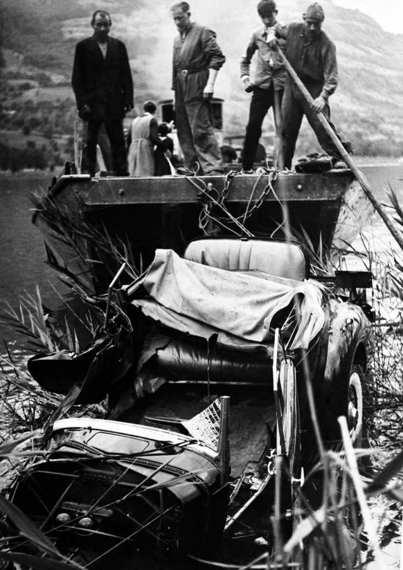 The wrecked car being salvaged from the lake side near Lucerne, Switzerland on August 30, 1935, after the car crash in which Queen Astrid of Belgium was killed whilst driving with her husband the day  ...