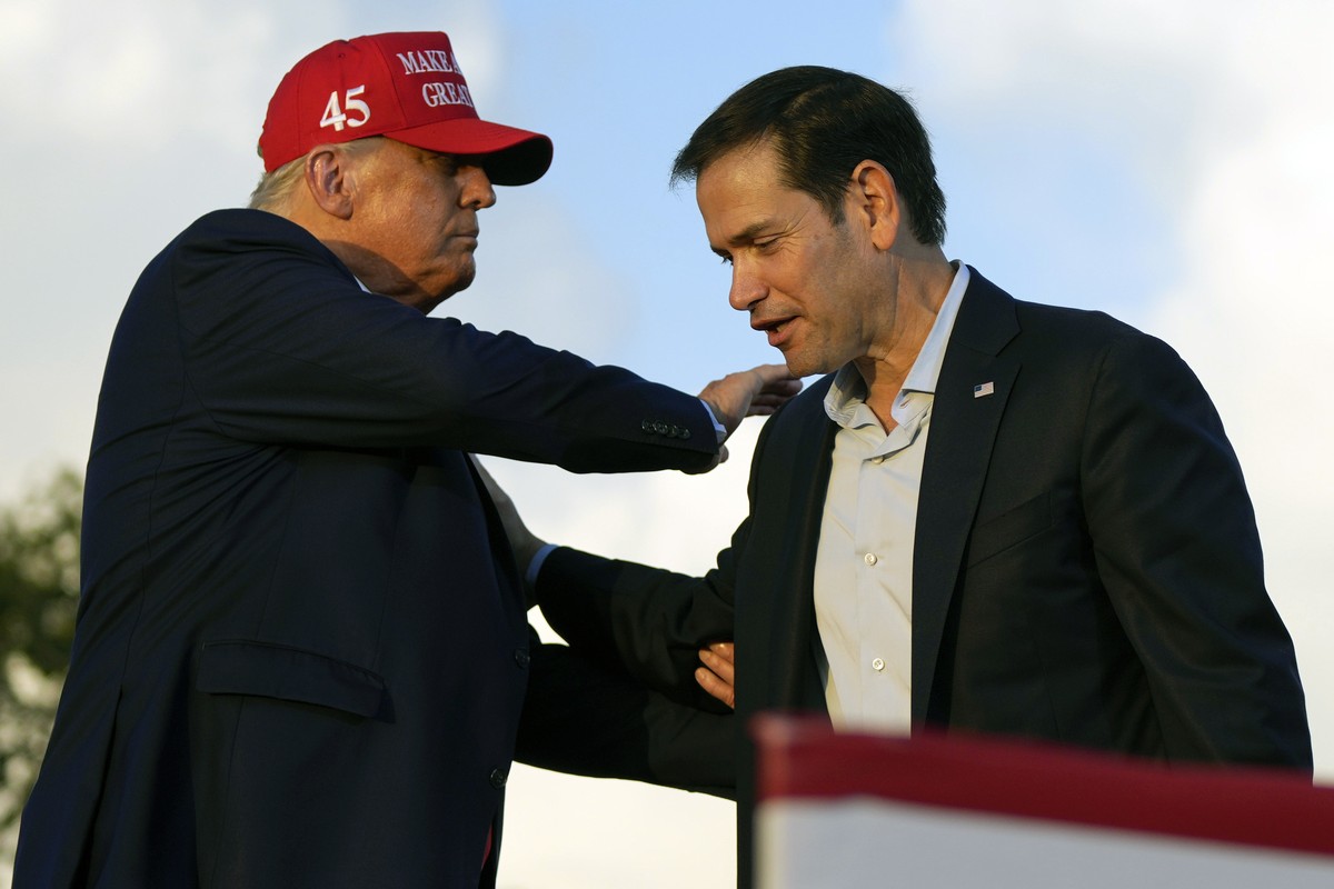 FILE - Then former President Donald Trump pats Sen. Marco Rubio, R-Fla., on the shoulder during a campaign rally at the Miami-Dade County Fair and Exposition in Miami, Nov. 6, 2022. (AP Photo/Rebecca  ...