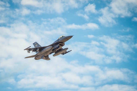 epa06186960 A handout photo made available by the 56 Fighter Wing Public Affairs Office of the US Air Force shows an F-16 Fighting Falcon flying over the flightline at Luke Air Force Base, in Arizona, ...