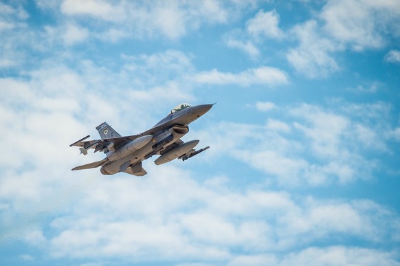 epa06186960 A handout photo made available by the 56th Fighter Wing Public Affairs Office of the United States Air Force shows an F-16 Fighting Falcon flying over the flight line at Luke Air Force Base, in Arizona, ...