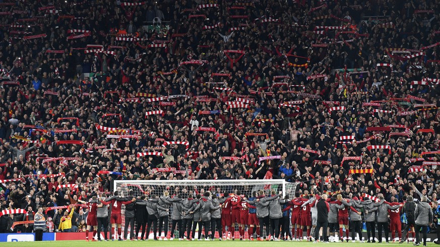 epa07888062 Liverpool players celebrate in front of their fans after the UEFA Champions League semi final 2nd leg match between Liverpool FC and FC Barcelona at Anfield in Liverpool, Britain, 07 May 2 ...