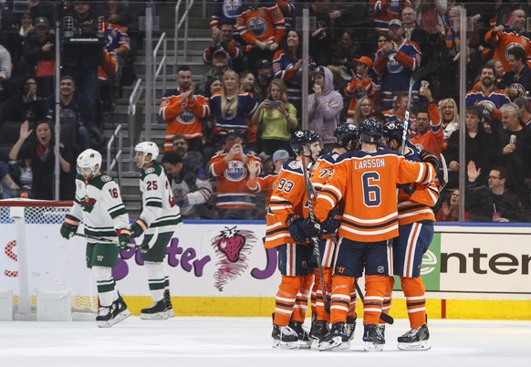 Edmonton Oilers celebrate a goal against the Minnesota Wild during the third period in an NHL hockey game in Edmonton, Alberta, Friday, Dec. 7, 2018. (Jason Franson/The Canadian Press via AP)