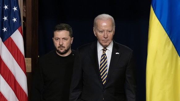 epa11025626 US President Joe Biden (R) and Ukrainian President Volodymyr Zelensky (L) enter the room to hold a joint news conference in the Indian Treaty Room of the Eisenhower Executive Office Buildi ...