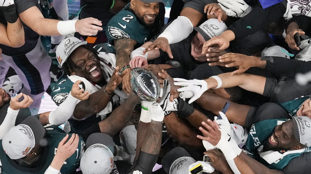 Philadelphia Eagles players celebrate with the Vince Lombardi Trophy after the Eagles won the NFL Super Bowl 59 football game against the Kansas City Chiefs, Sunday, Feb. 9, 2025, in New Orleans. (AP  ...