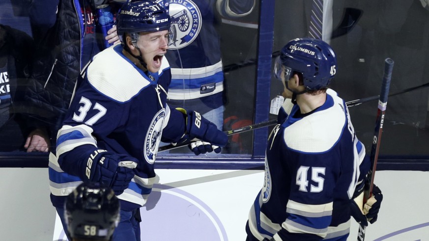 Columbus Blue Jackets forward Markus Hannikainen, center, of Finland, celebrates with teammates defenseman David Savard, left, and forward Lukas Sedlak, of the Czech Republic, after Hannikainen&#039;s ...