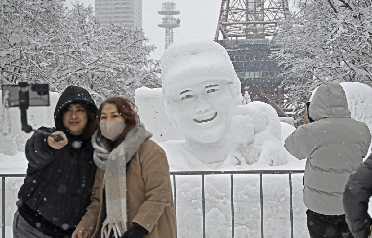 A snow sculpture of Los Angeles Dodgers' Shohei Ohtani is covered with snow at the Sapporo Snow Festival, Tuesday, Feb. 4, 2025, in Sapporo, Hokkaido, Japan. (Kyodo News via AP)