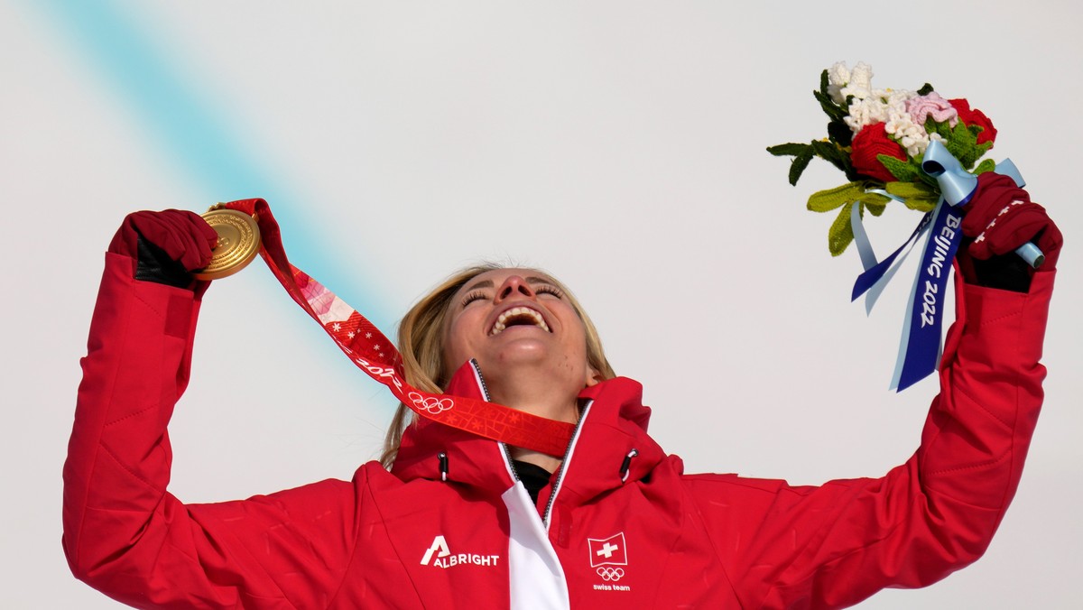 FILE - Lara Gut-Behrami, of Switzerland celebrates during the medal ceremony after winning the gold medal in the women's super-G at the 2022 Winter Olympics, Friday, Feb. 11, 2022, in the Yanqing ...