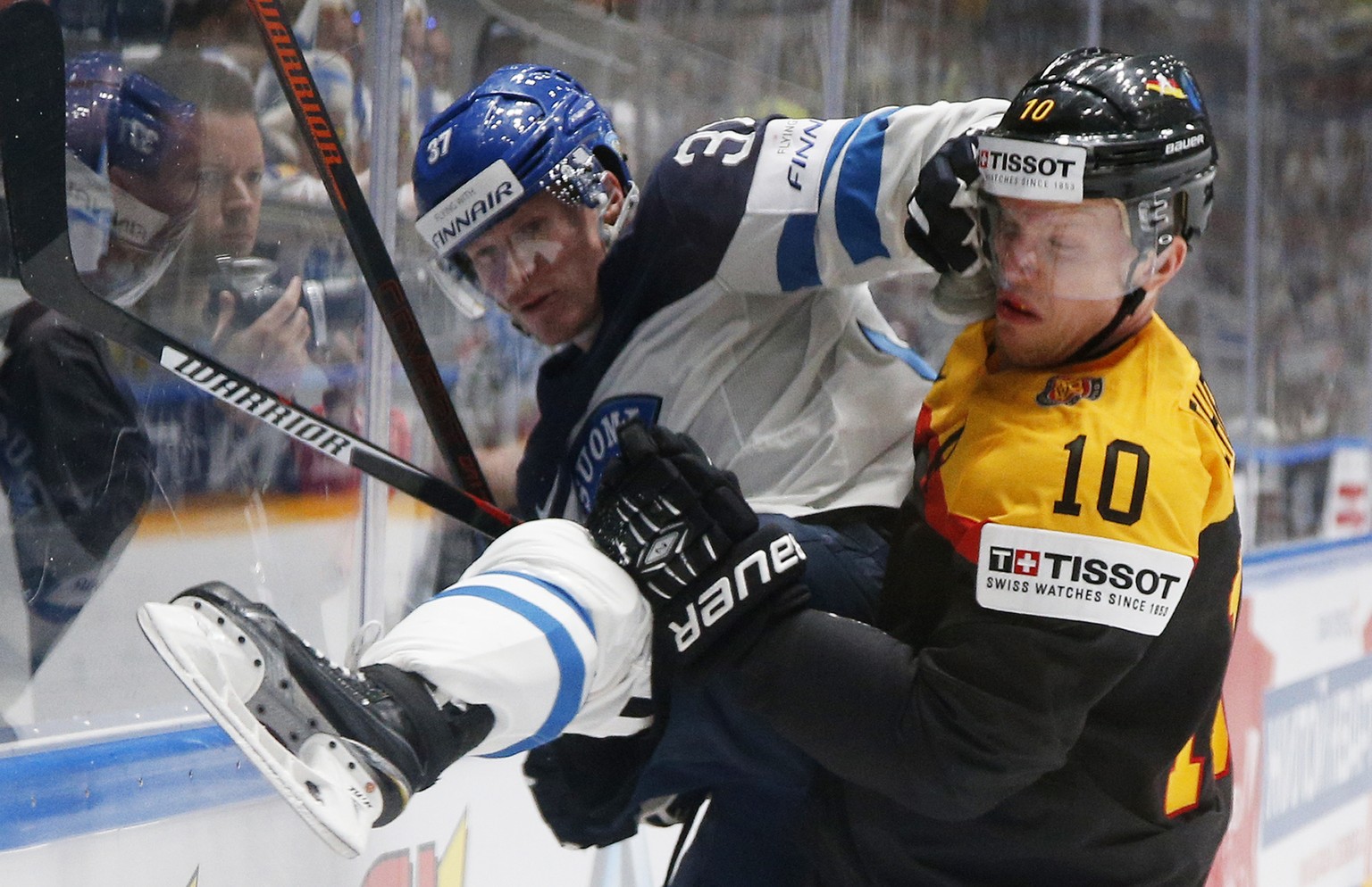 Germanys Christian Ehrhoff challenges Mika Pyorala of Finland during the Hockey World Championships Group B match in St.Petersburg, Russia, Sunday, May 8, 2016. (AP Photo/Dmitri Lovetsky)