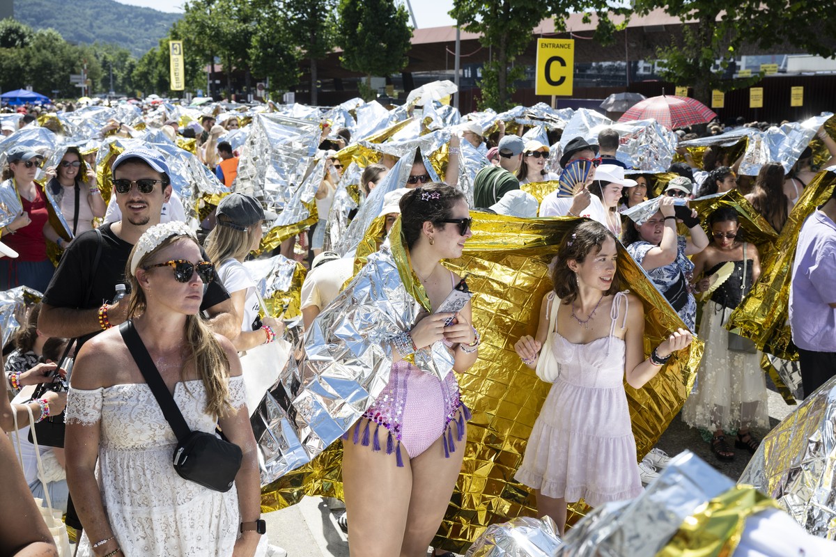 epa11468040 Fans, also known as 'Swifties', wait to attend the concert of US singer and songwriter Taylor Swift as part of her 'The Eras Tour' in front of the Letzigrund Stadium in ...