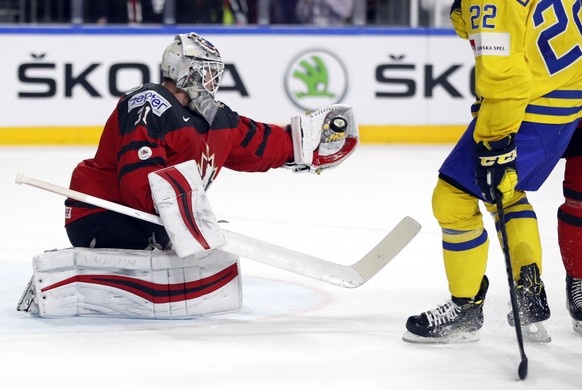 Canada&#039;s goalie Calvin Pickard makes a save in front of Sweden&#039;s Joel Eriksson Ek during the Ice Hockey World Championships final match between Canada and Sweden in the LANXESS arena in Colo ...