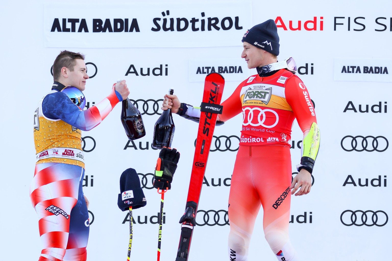 epa11034118 Second placed Filip Zubcic (L) of Croatia and winner Marco Odermatt (R) of Switzerland celebrate on the podium after the Men&#039;s Giant Slalom race of the Alpine Skiing World Cup in Alta ...