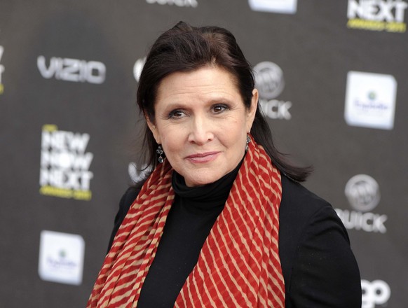 FILE - This April 7, 2011 file photo, shows Carrie Fisher at the 2011 NewNowNext Awards in Los Angeles. Fisher is receiving a star on the Hollywood Walk of Fame on Thursday, a May the Fourth tribute t ...