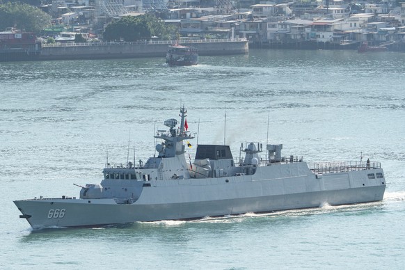 Chinese People's Liberation Army Hong Kong garrison's guided-missile frigate Suqian sailed into the Victoria Harbour for port call in Hong Kong, Tuesday, Sept. 30, 2025. (AP Photo/Chan Long  ...