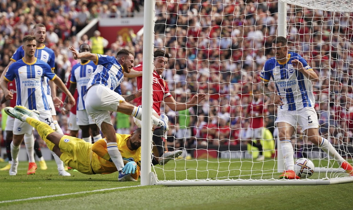 Brighton's Alexis Mac Allister, third from right, scores an own goal during the English Premier League soccer match between Manchester United and Brighton at Old Trafford stadium in Manchester, E ...
