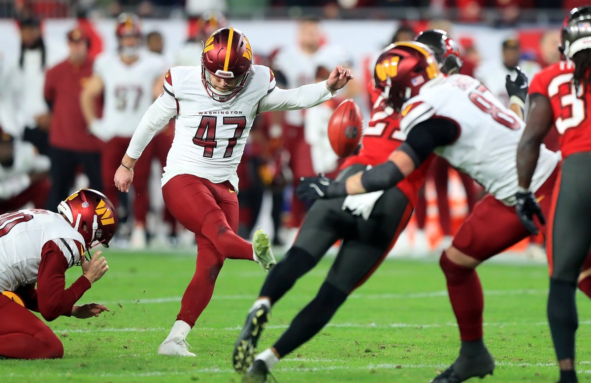 TAMPA, FL - JANUARY 12: Washington Commanders Kicker Zane Gonzalez 47 kicks the game winning field goal during the NFC Wild Card Playoff game between the Washington Commanders and the Tampa Bay Buccan ...