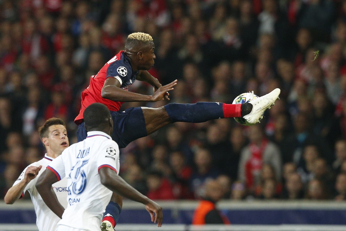 Lille's Victor Osimhen, top, kicks the ball during the group H Champions League soccer match between Lille and Chelsea at the Stade Pierre Mauroy - Villeneuve d'Ascq stadium in Lille, France ...