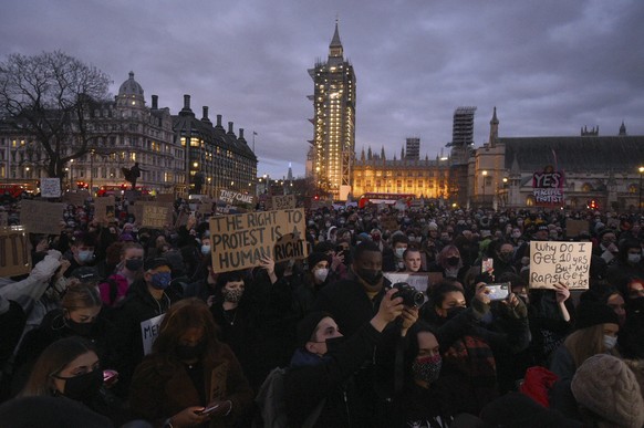 People in Parliament Square take part in a demonstration against gender violence following the murder of Sarah Everard, in London, Tuesday March 16, 2021. The British government plans to increase fund ...