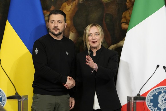 FILE - Ukrainian President Volodymyr Zelenskyy, left, and Italian Premier Giorgia Meloni shake hands during a press conference after their meeting at Chigi Palace, Government&#039;s office, in Rome, S ...