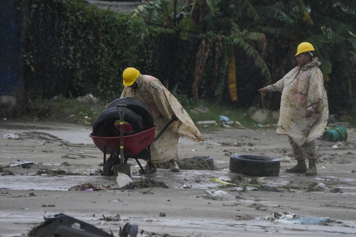 Mexican soldiers remove tires from the mud caused by hurricane Norma hit a beach in San Jose del Cabo, Mexico, Saturday, Oct. 21, 2023. Norma had weakened and was downgraded to Category 1 on the hurri ...