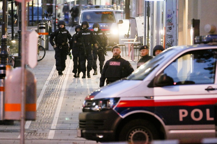 Following gunfire on people enjoying a last evening out before lockdown, police patrol at the scene in Vienna, early Tuesday, Nov. 3, 2020. Police in the Austrian capital said several shots were fired ...