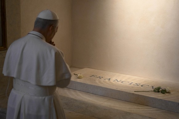 Pope Leo XIV prays on the tomb of late Pope Francis in St. Mary Major Basilica in Rome, where he made a surprise visit two days after his election, Saturday, May 10, 2025. (Vatican Media via AP)
Vatic ...