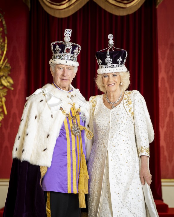 In this photo made available by Buckingham Palace on Monday, May 8, 2023, King Charles III and Queen Camilla are pictured in the Throne Room at Buckingham Palace, London. (Hugo Burnand/Royal Household ...