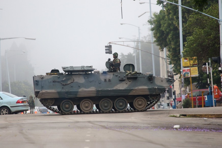 epaselect epa06330383 An army tanker blocks the main road to Parliament building in Harare, Zimbabwe, 15 November 2017, to prevent members of the public from passing through. The Zimbabwe National Arm ...