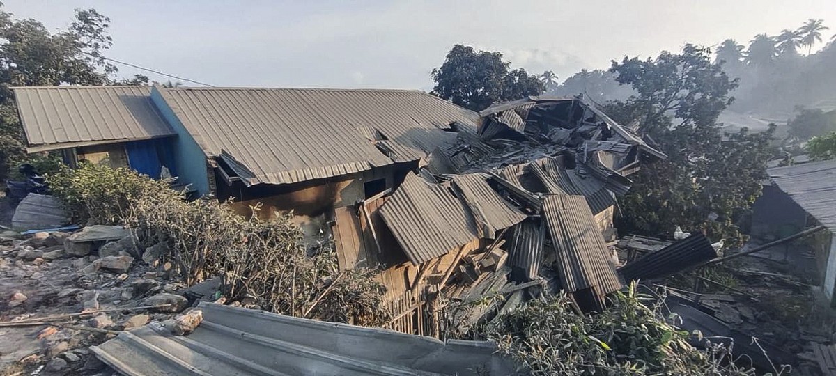epa11700169 A handout photo made available by the East Flores Regional Disaster Management Agency (BPBD) shows damaged houses following the eruption of the Lewotobi Laki-Laki volcano in East Flores, E ...
