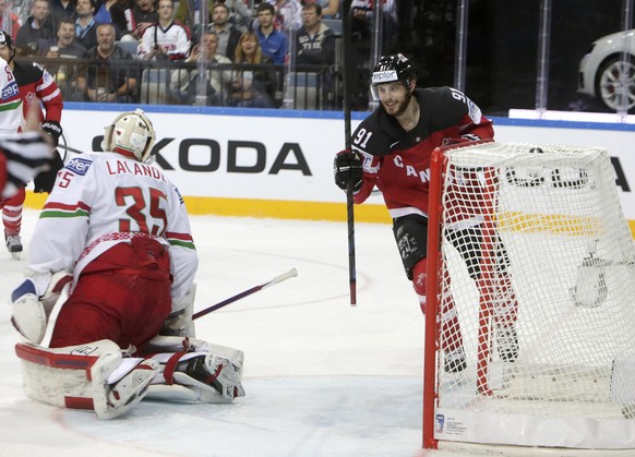 Canada&#039;s Tyler Seguin (R) celebrates a goal of his teammate Ryan O&#039;Reilly (not seen) past goaltender Kevin Lalande of Belarus during their Ice Hockey World Championship quarterfinal game at  ...